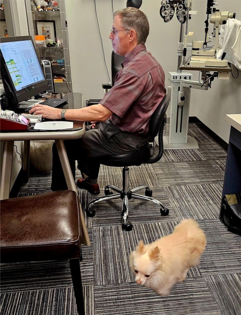 dr-johnsey-with-dog-optometry-office-lawrenceville-ga